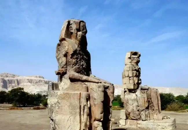 Colossi-Of-Memnon-Featured-Image-Giant-Statues-Of-Amenhotep-III-In-Luxor-EgyptaTours