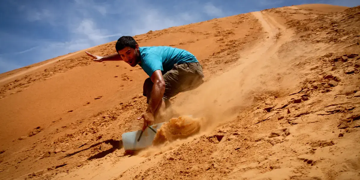 Family Vacations to Egypt: Safe, Fun & Unforgettable Travel Guide 9 Sand-Boarding