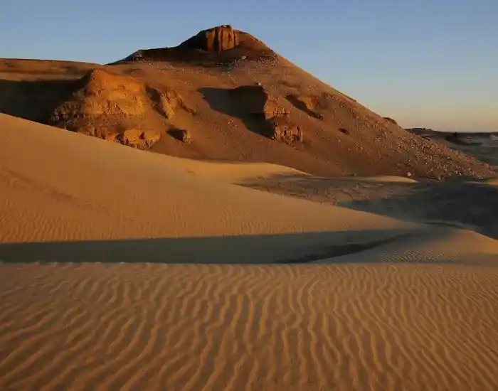 Sand-Dunes-And-Desert-Mountain-Landscape-At-Sunset-In-Dakhla-Oasis-EgyptaTours