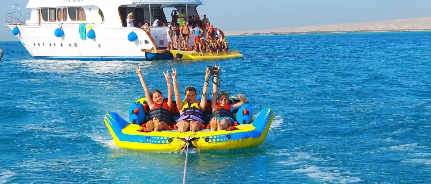 Top Things to Do in Egypt with Family: Fun and Adventure for All Ages 4 Enjoying-Beach-Activities-in-Hurghada-with-family-EgyptaTours