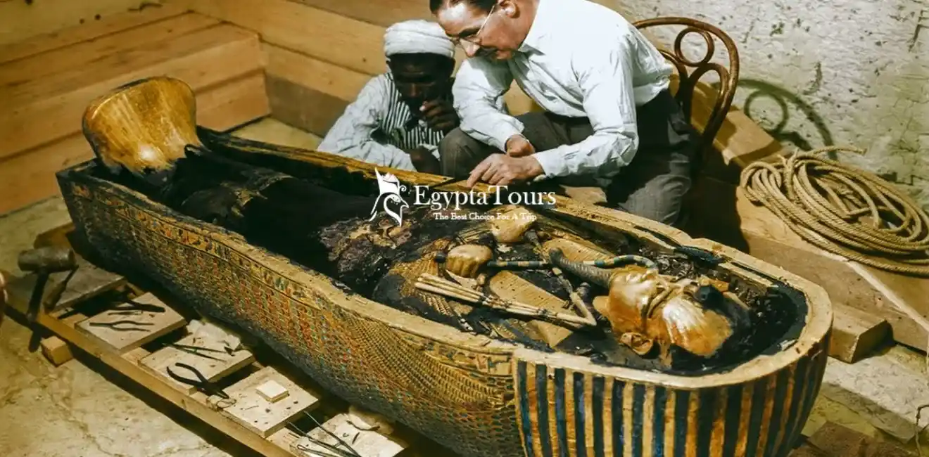 British-archaeologist-Howard-Carter-examining-the-sarcophagus-of-King-Tutankhamun-in-1922-EgyptaTours
